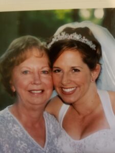 Bride and mother smiling
